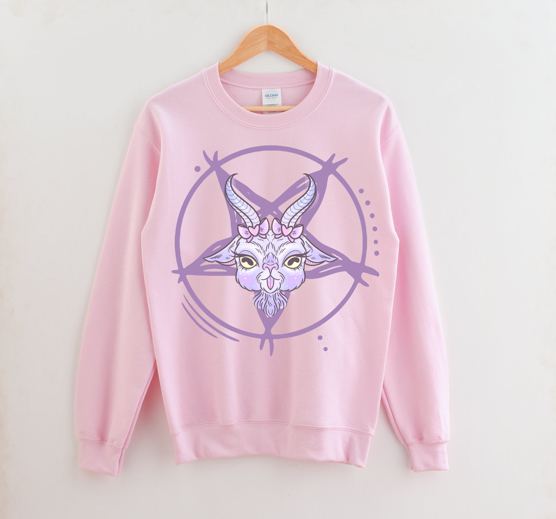 pink pastel goth sweatshirt displayed on clean white background