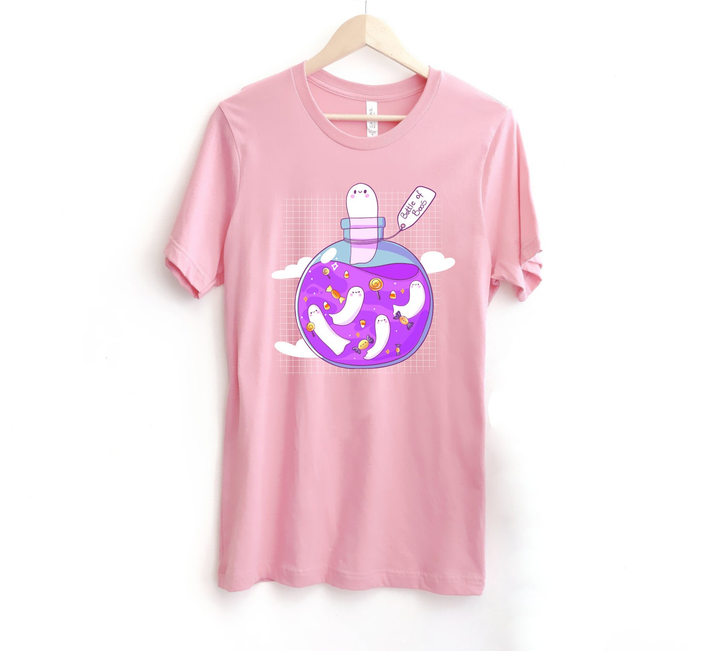 pink t-shirt with Halloween ghost design on a white background