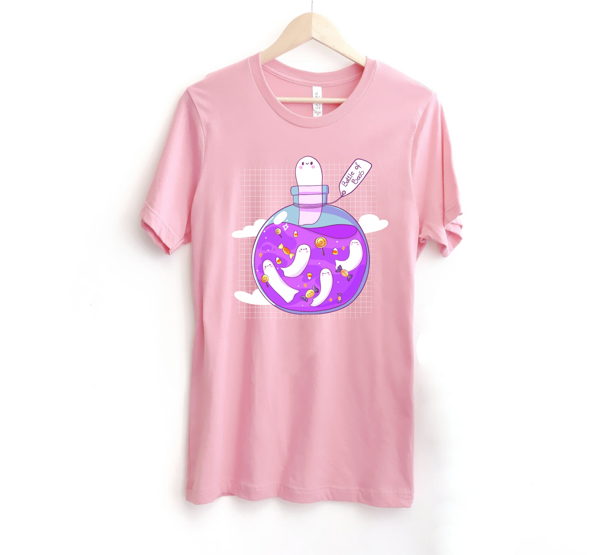 pink t-shirt with Halloween ghost design on a white background