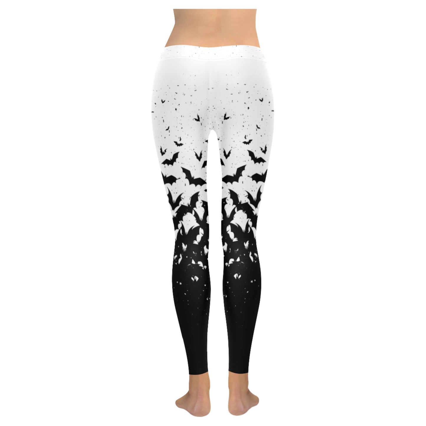 White and black pastel goth leggings displayed on clean white background.