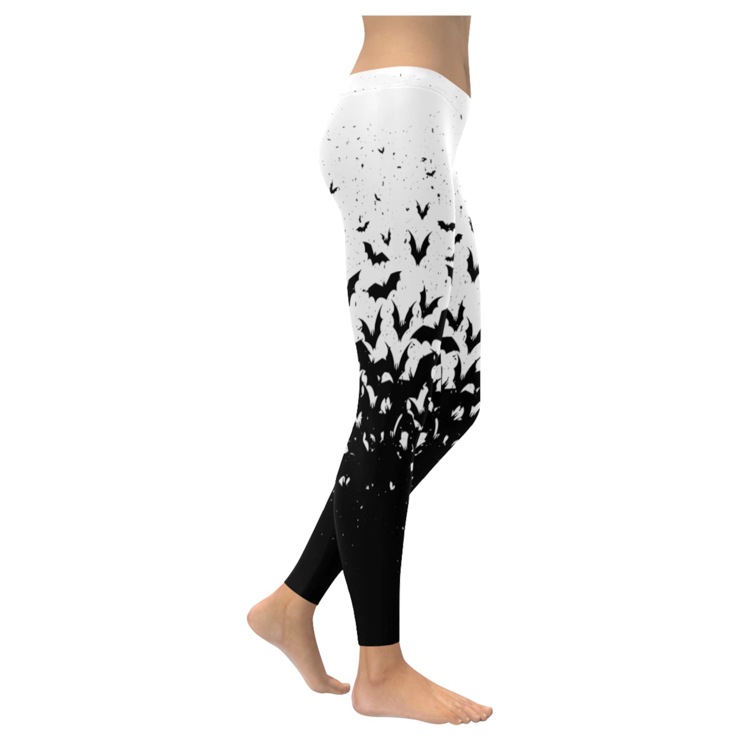 White and black pastel goth leggings displayed on clean white background.