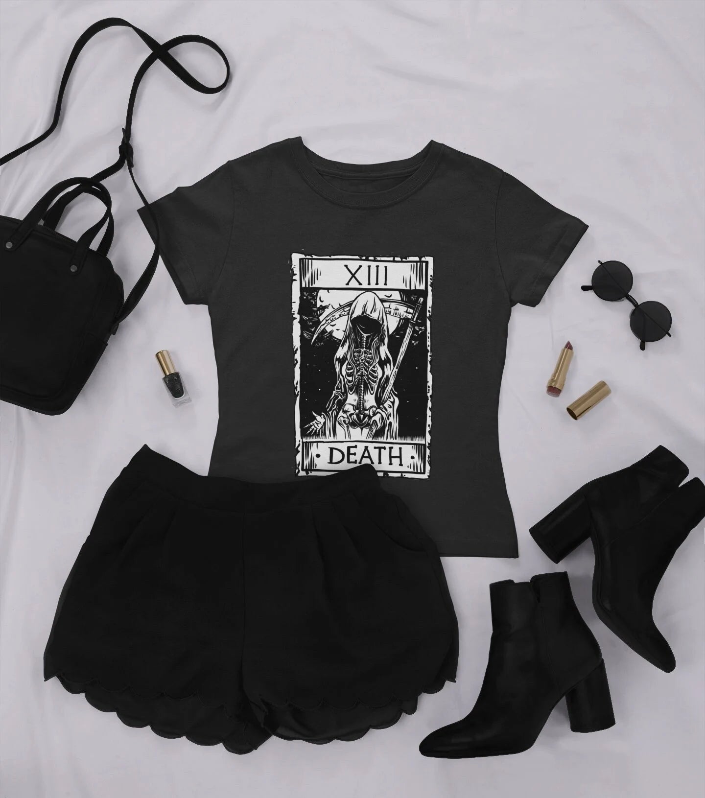 goth t-shirt with death tarot card and black accessories on white background