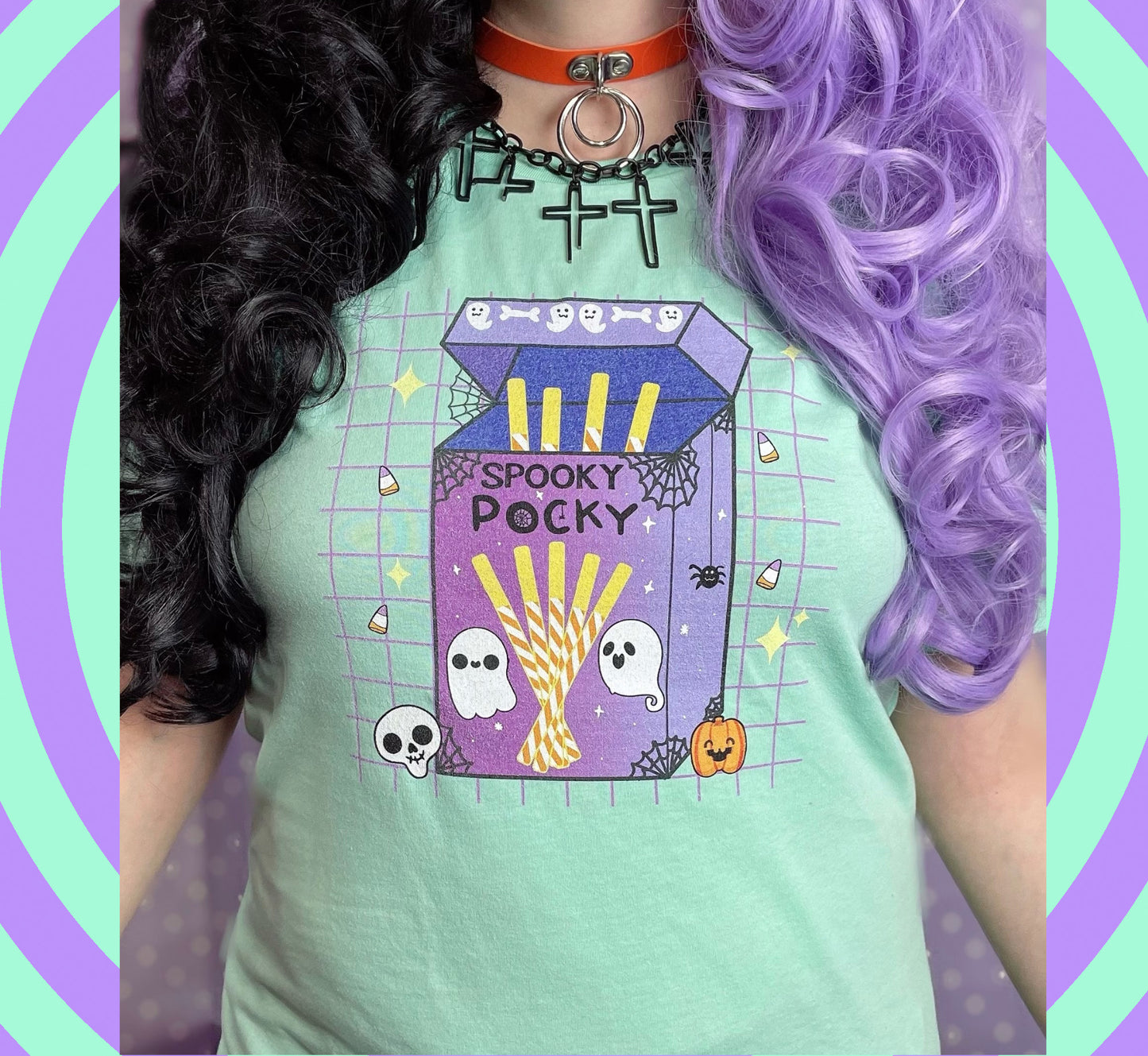 Girl with purple hair and Halloween-themed t-shirt against a colorful spiral background