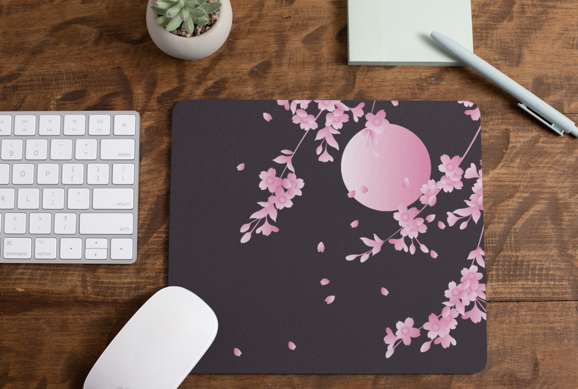 Soft kawaii desk mat with adorable floral design on a tidy workspace