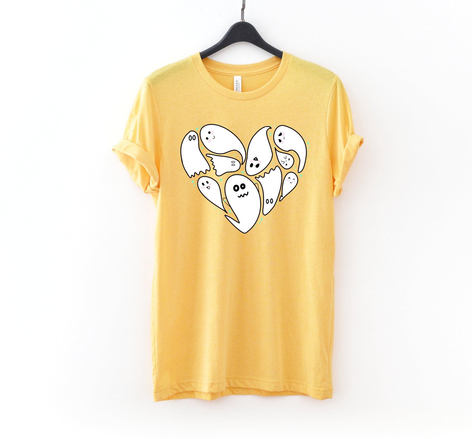 Yellow t-shirt with Halloween ghost design on a white background