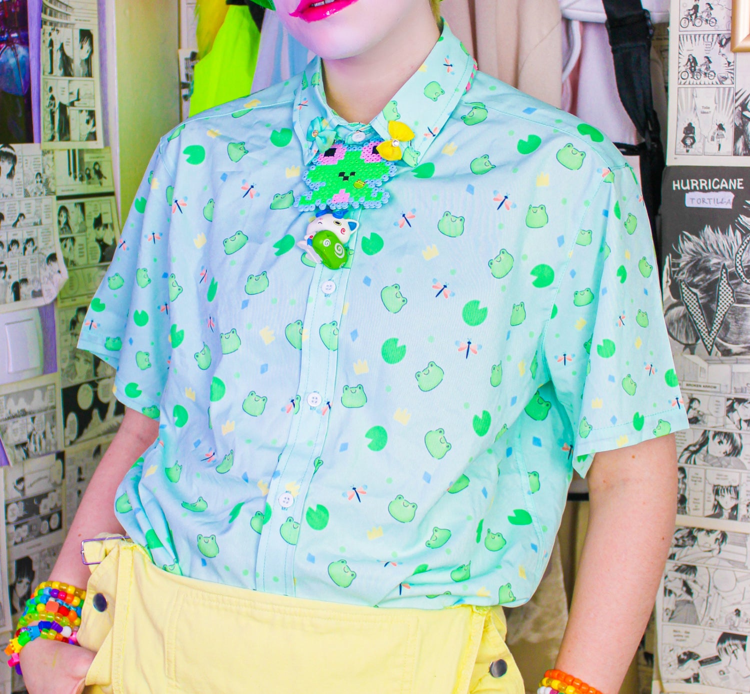 Youthful model wearing a cute kawaii  frog shirt with pastel colours