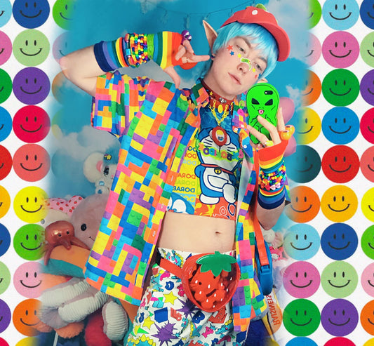 Youthful model wearing a cute harajuku shirt with rainbow accessories
