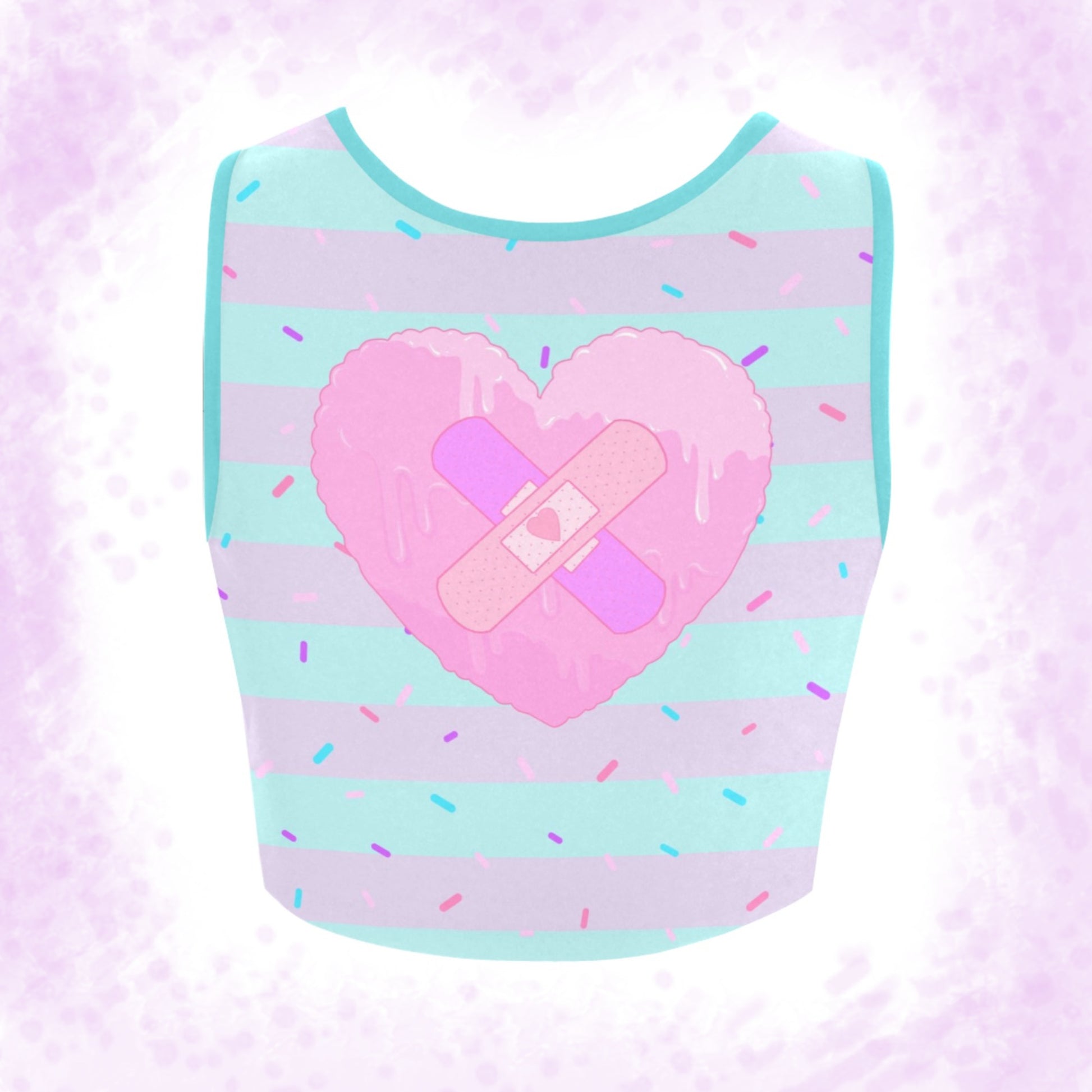 menhera Band Aid Heart Crop Top displayed on a pattern background