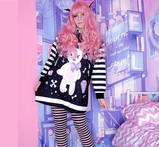 young model wearing a pastel goth Kawaii bunny hoodie dress