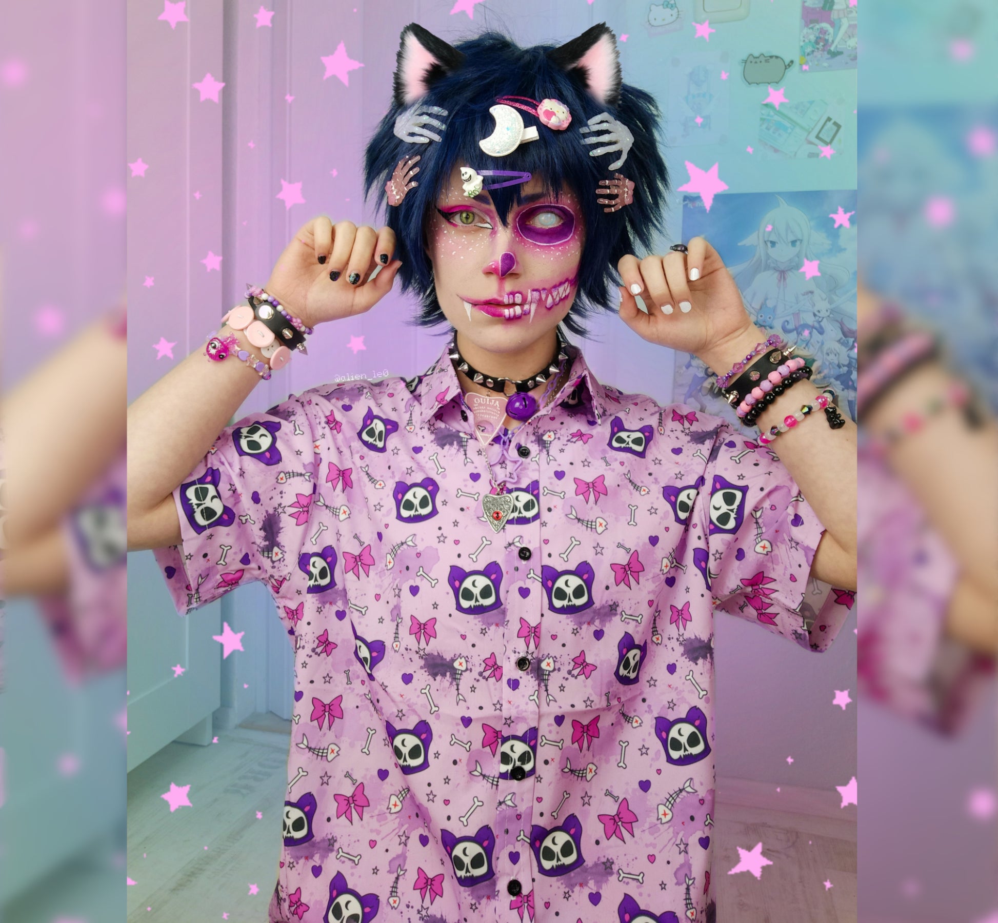 Model wearing a pastel goth button up shirt with  cute cat designs.