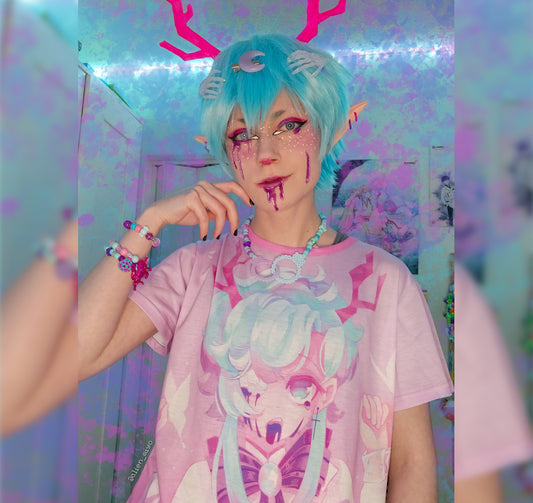 Young boy wearing a pastel spooky kawaii t-shirt 