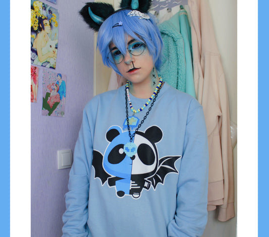 Model wearing a pastel goth spooky bat panda  yami kawaii sweatshirt