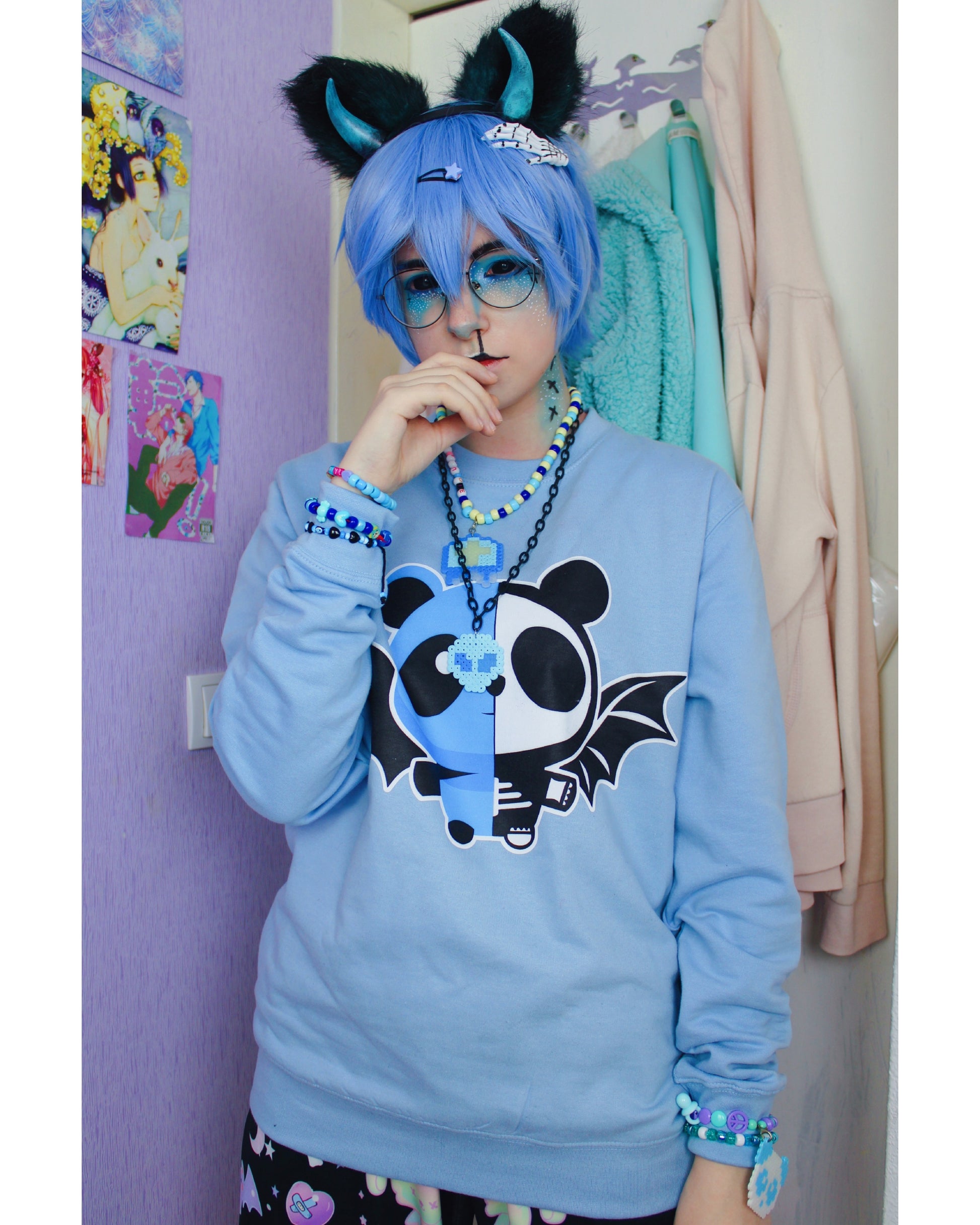 Model wearing a pastel goth spooky bat panda  yami kawaii sweatshirt