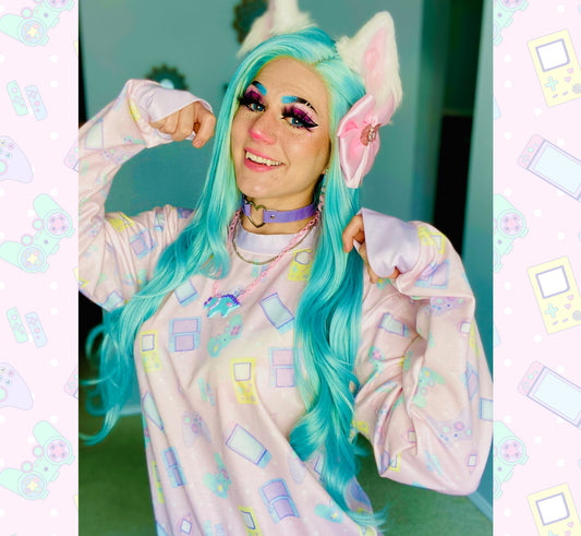 Youthful model wearing a cute videogame kawaii sweatshirt with pastel accessories