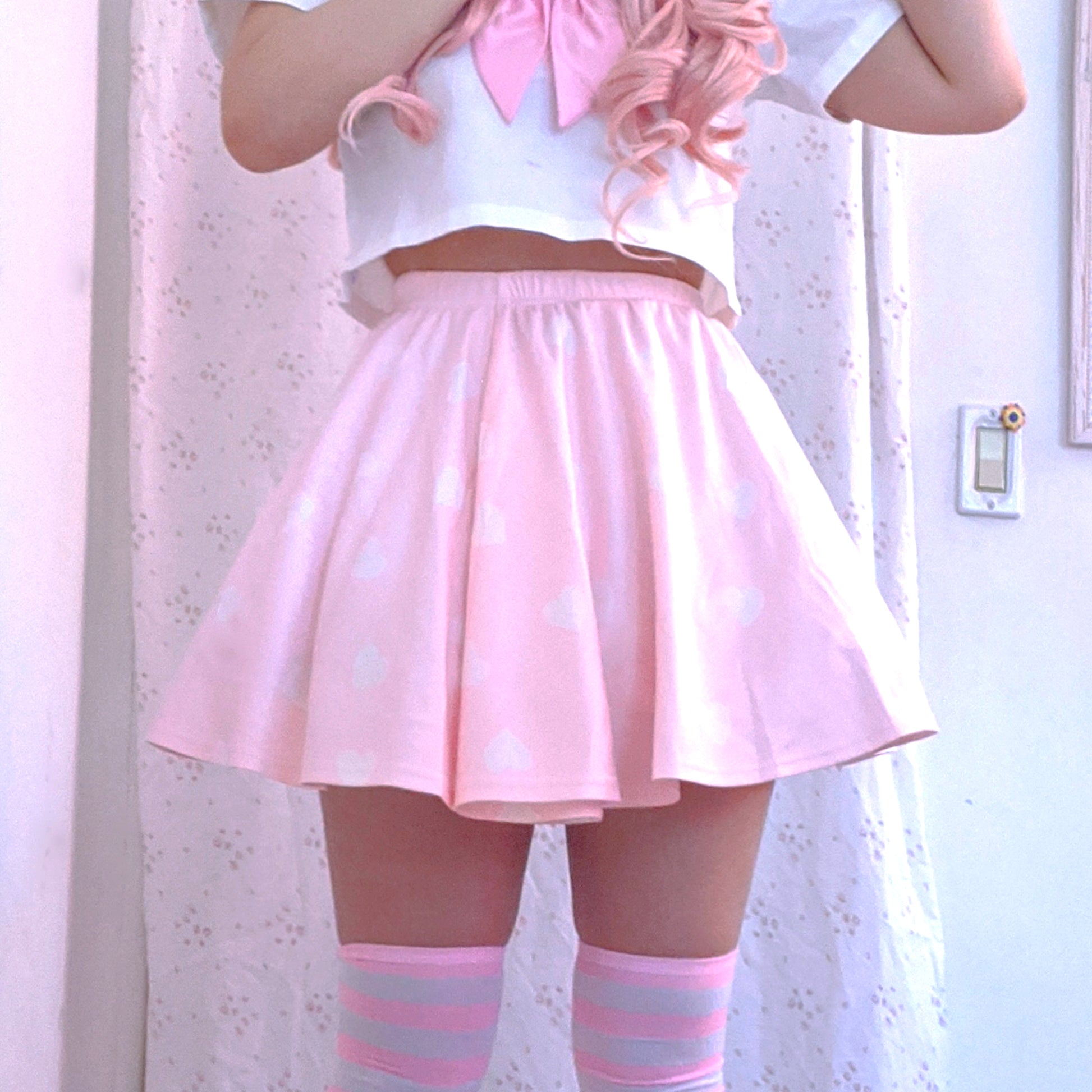Youthful model wearing a cute kawaii skirt with pastel accessories