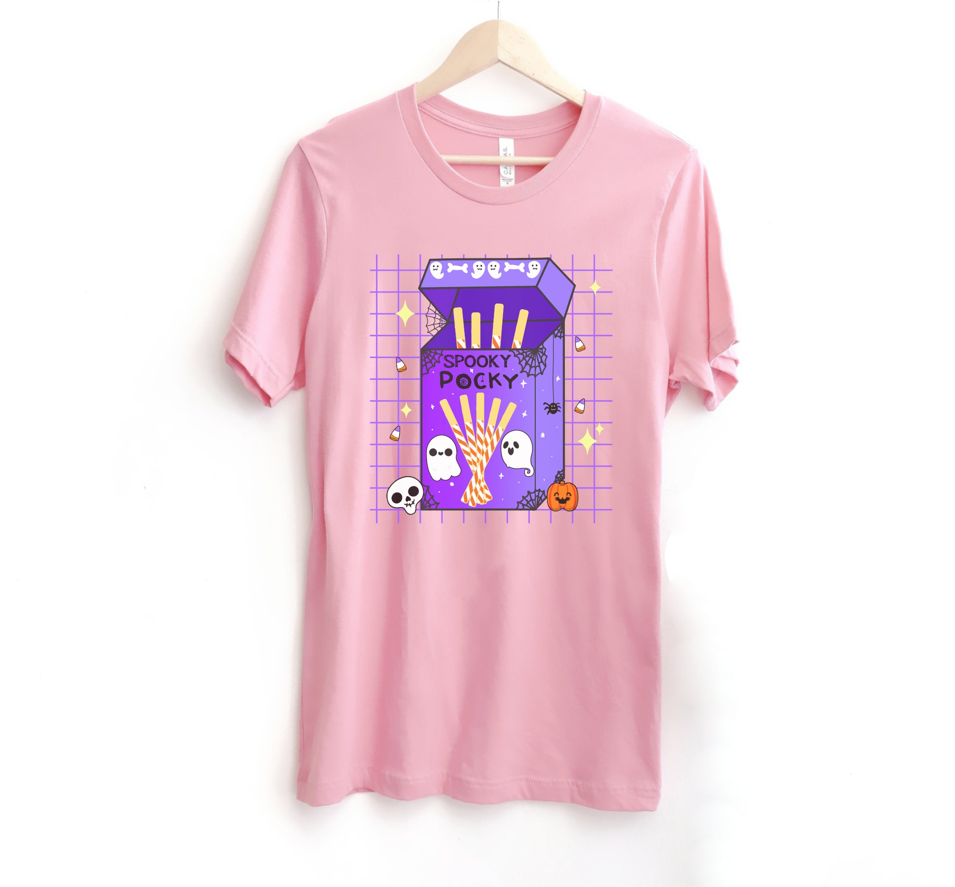 Pink t-shirt with a Halloween-themed design on a white background
