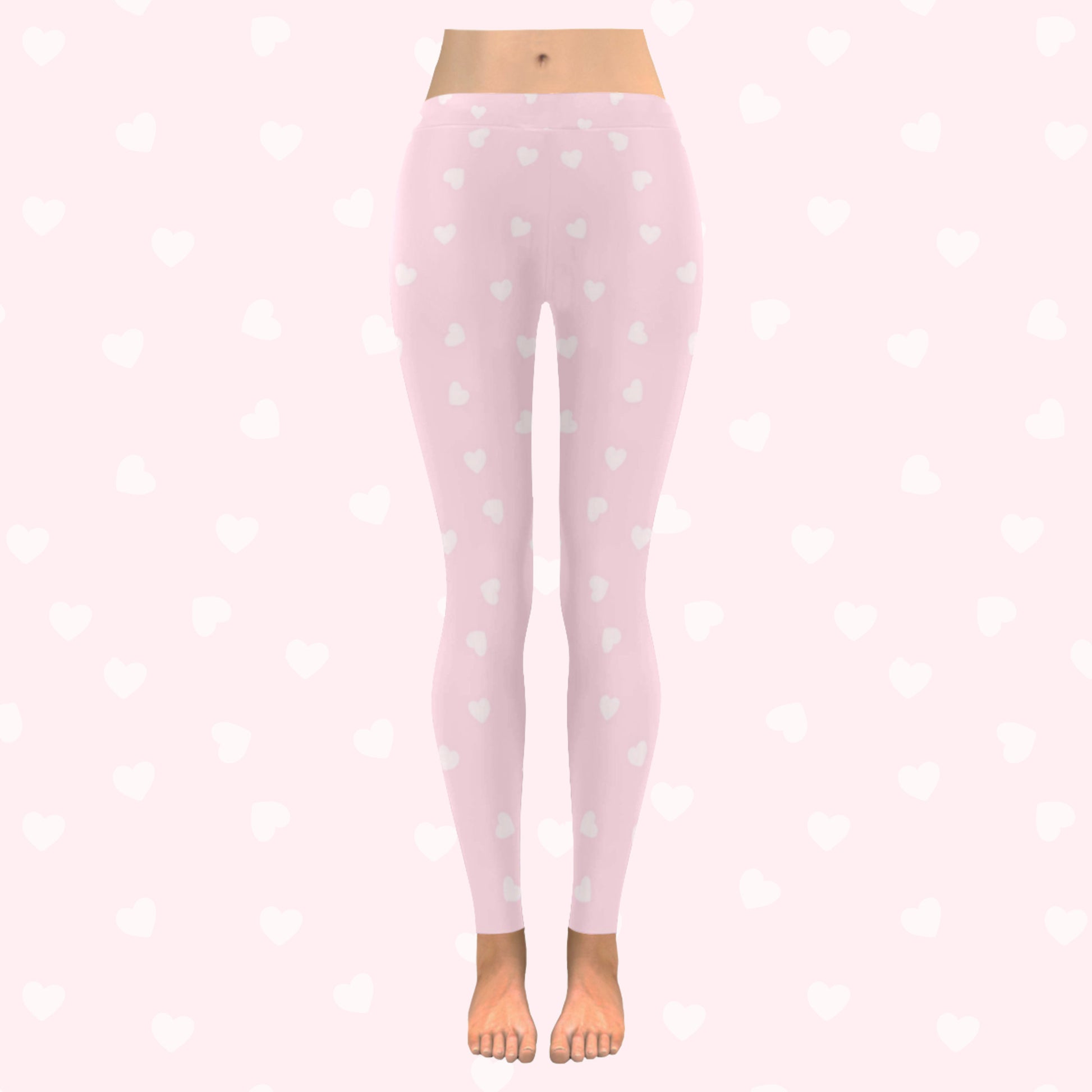 model wearing pink heart yume kawaii leggings on pink heart  background
