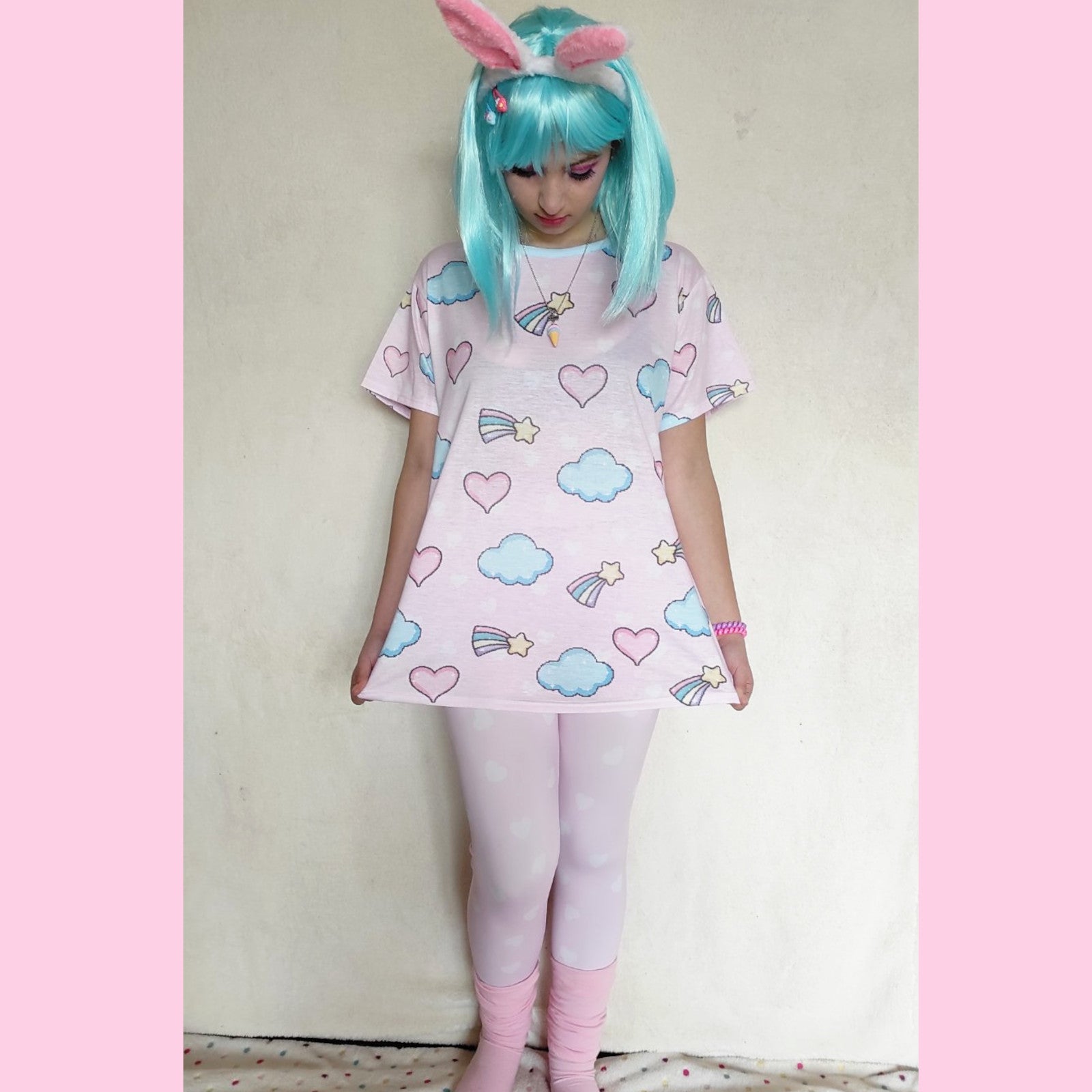 youthful model wearing pink heart yume kawaii leggings in pastel colours 