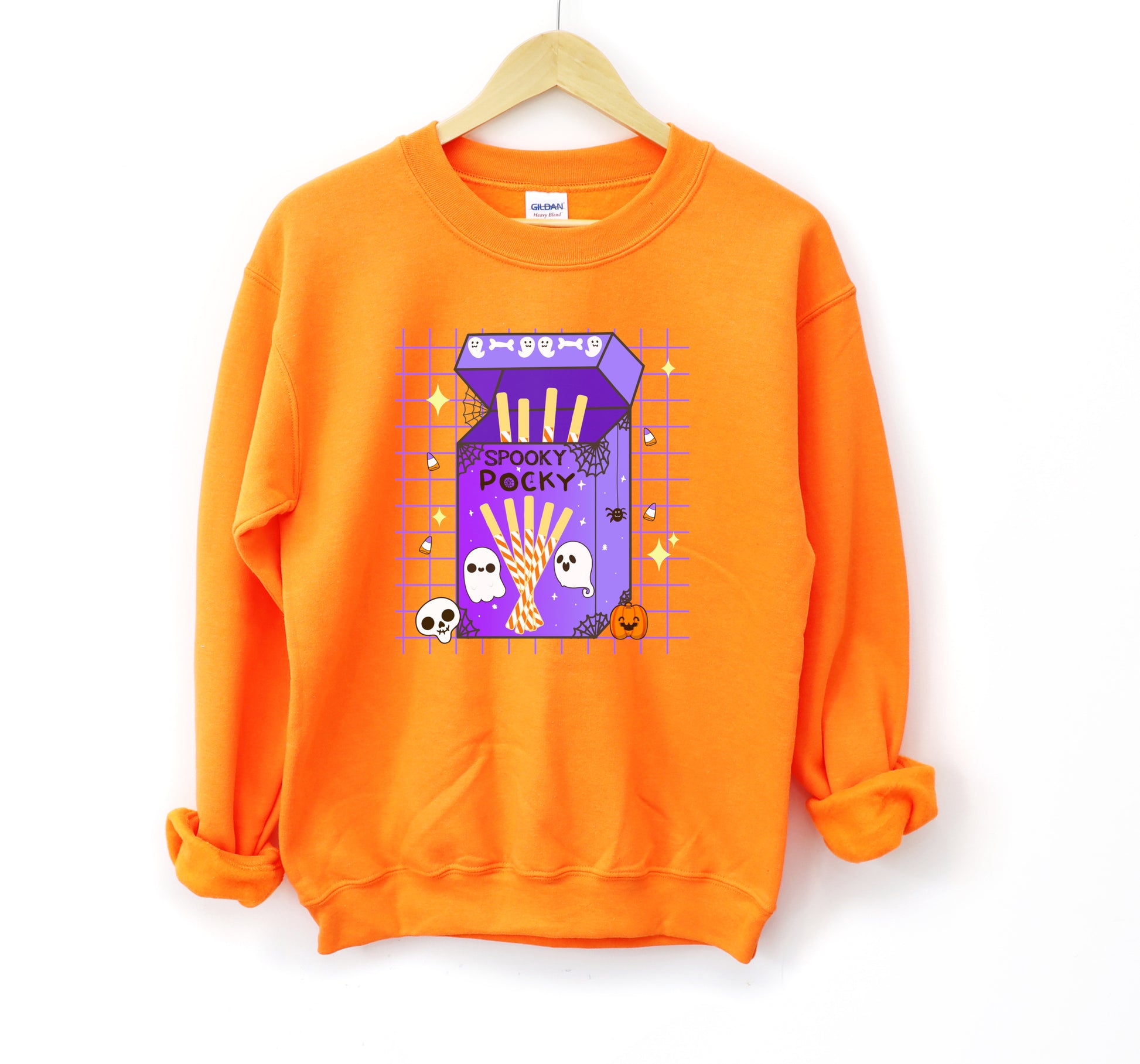 Orange sweatshirt with Halloween-themed design on a white background