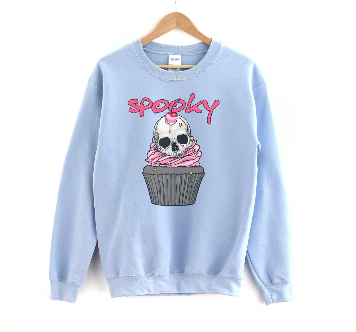 Kawaii Goth sweatshirt with Halloween-themed graphics of a skull cupcake on a white background.