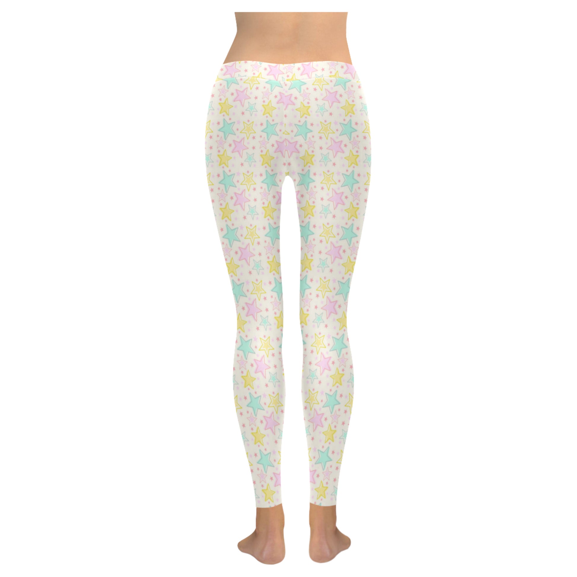 Youthful model wearing cute Yume Kawaii star leggings in pastel colours on white background