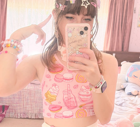 Teen girl in a kawaii graphic crop top  with soft colors 
