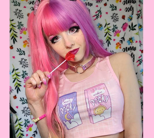 Cute girl modeling a kawaii aesthetic crop top  featuring playful, pastel artwork