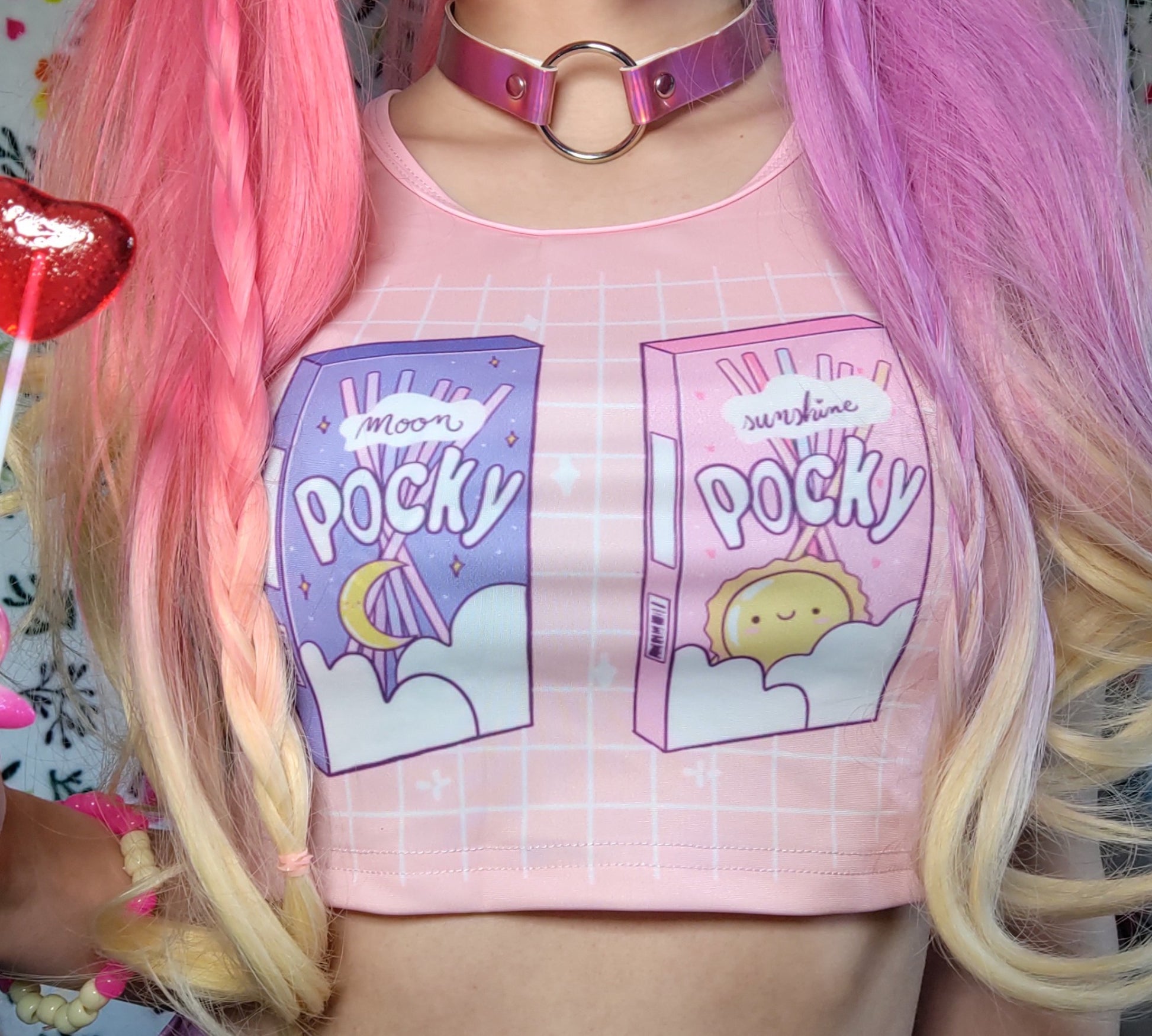 Cute girl modeling a kawaii aesthetic crop top  featuring playful, pastel artwork