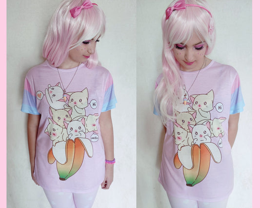 Young girl wearing a pastel kawaii t-shirt with a cute print of cats inside a banana